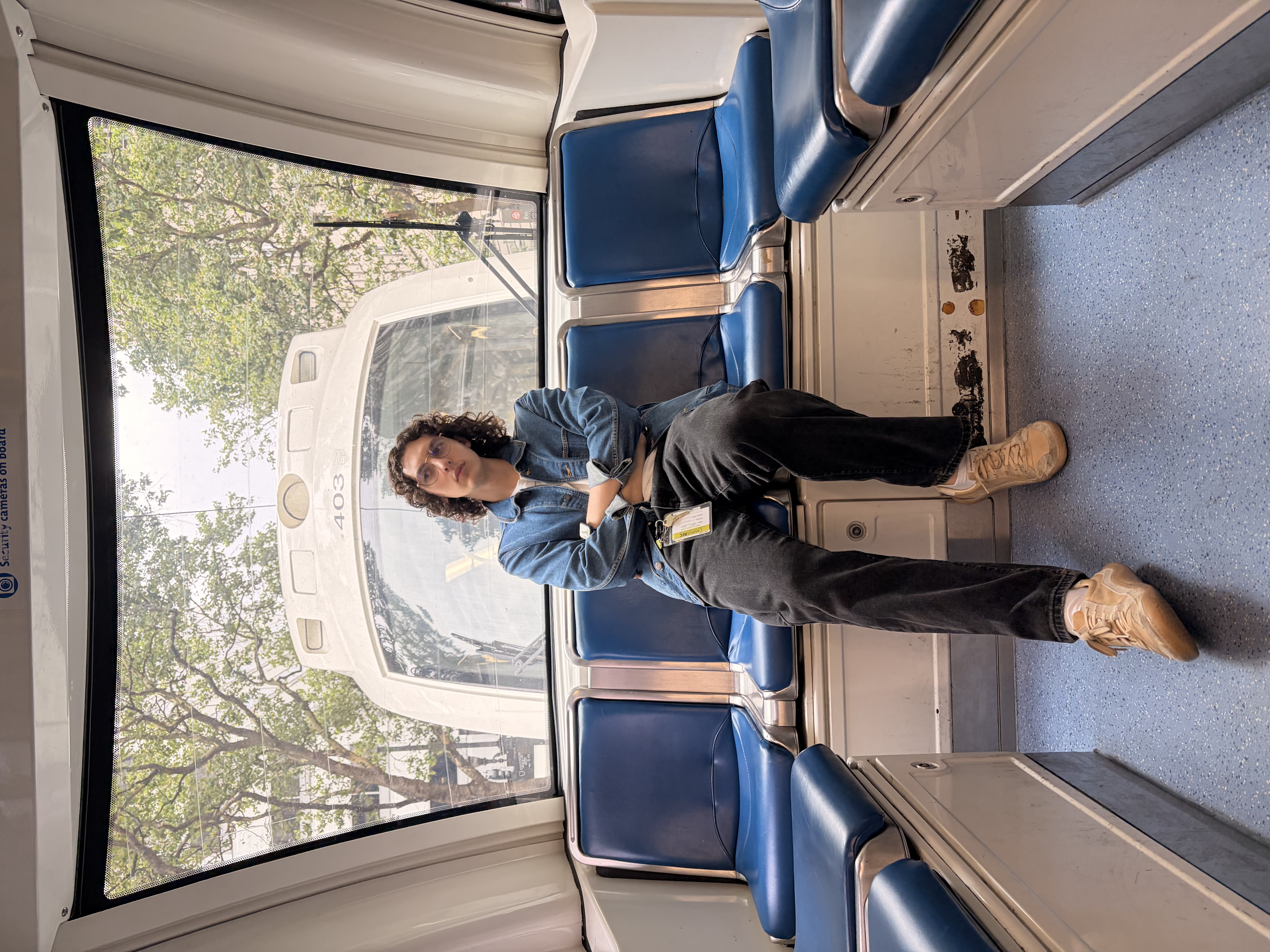 Evan posing on a train